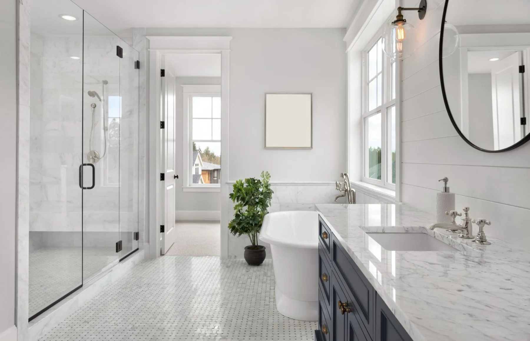 Bathroom with tiled shower and fixtures