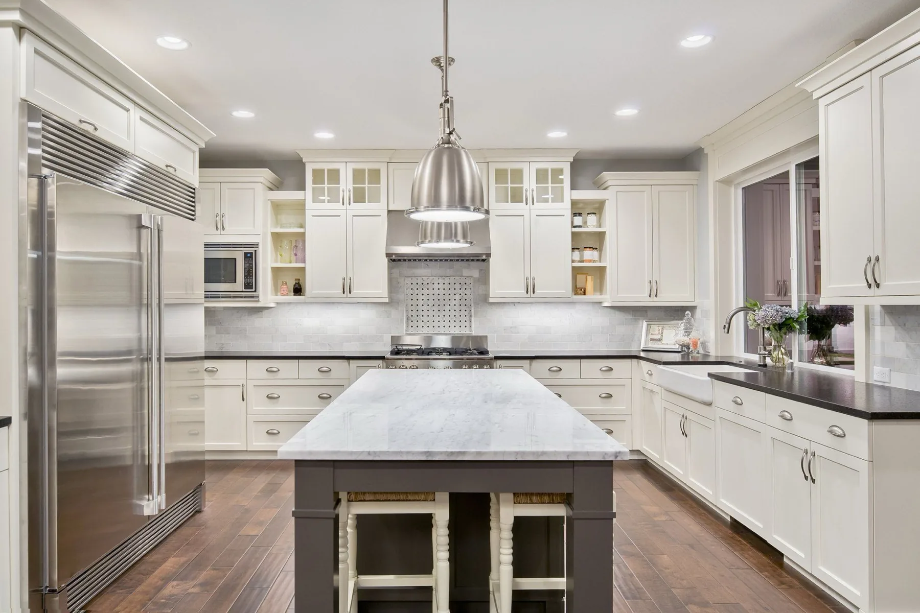 Kitchen with an island and full-height cabinetry